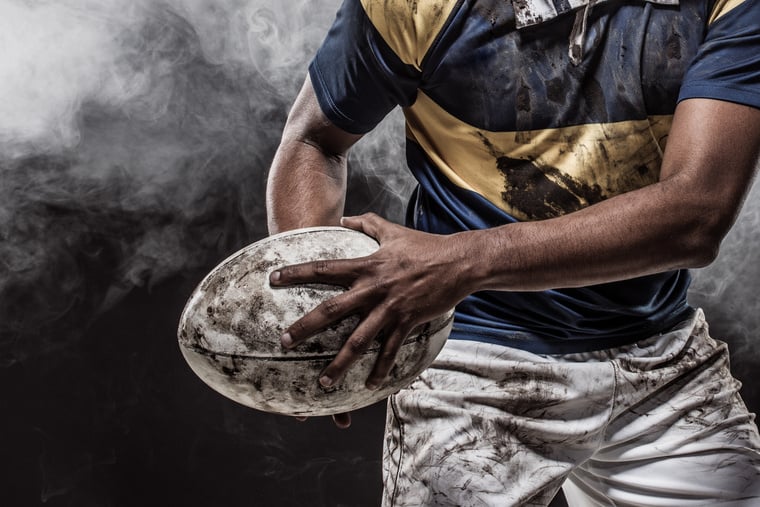 A bloody muddy Rugby Player